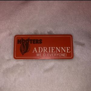 USED Hooters Girl orange name tag - ADRIENNE